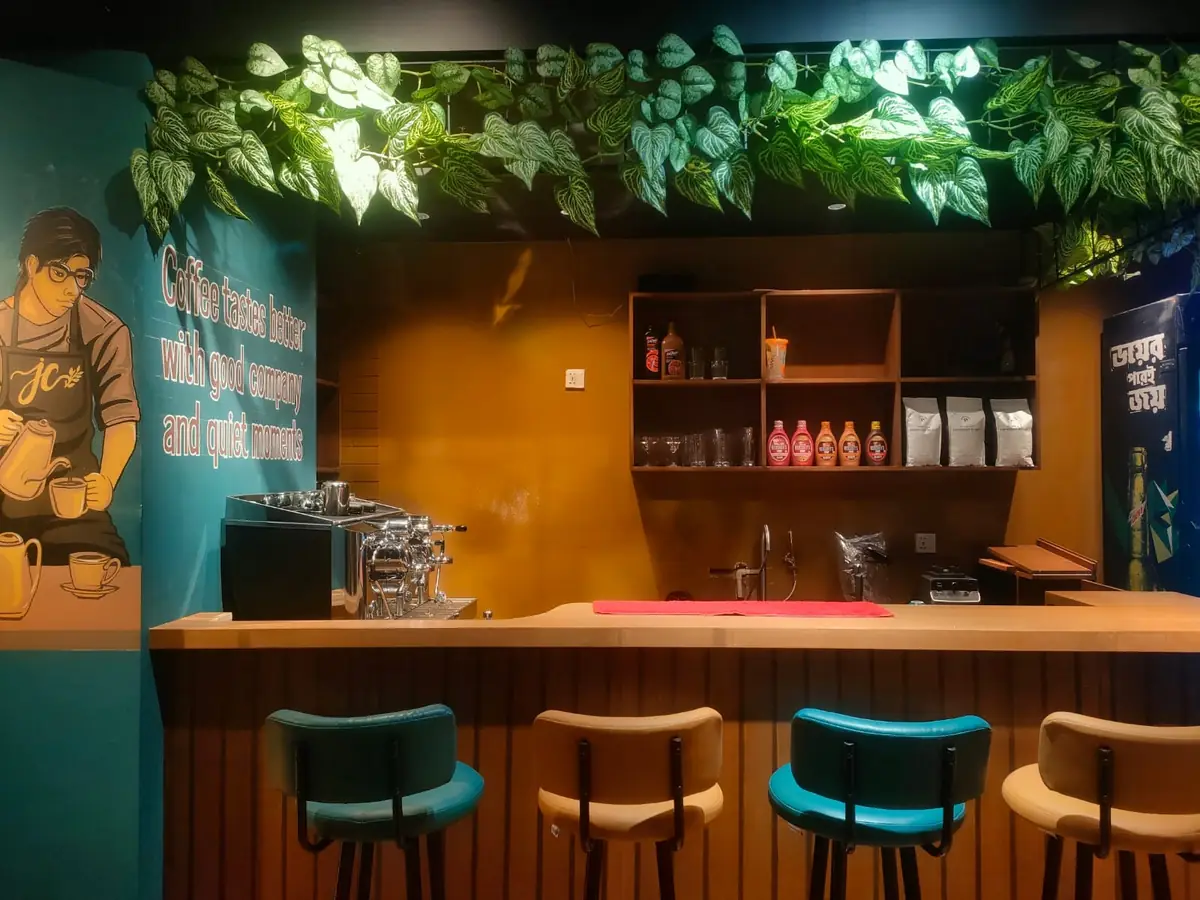 Jessy's Courtyard café counter with greenery
